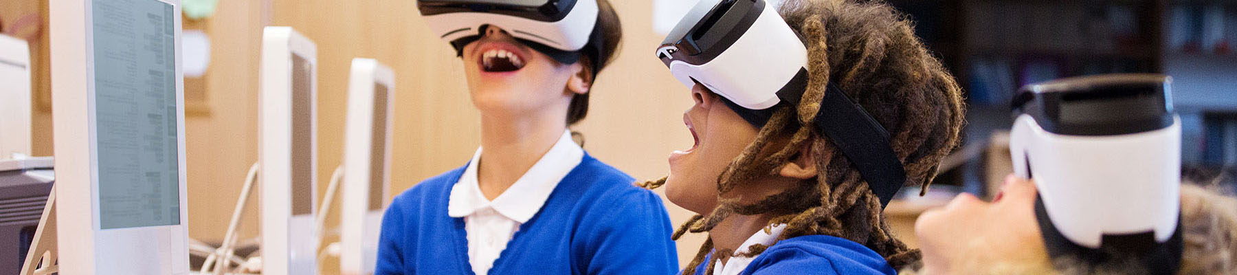 Kids playing with Virtual Reality machines in a computer lab