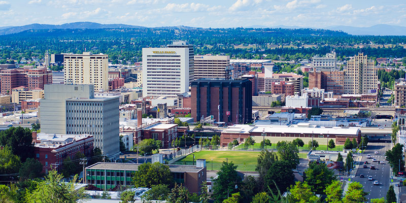 A wide view of the downtown Spokane skyline during the day.